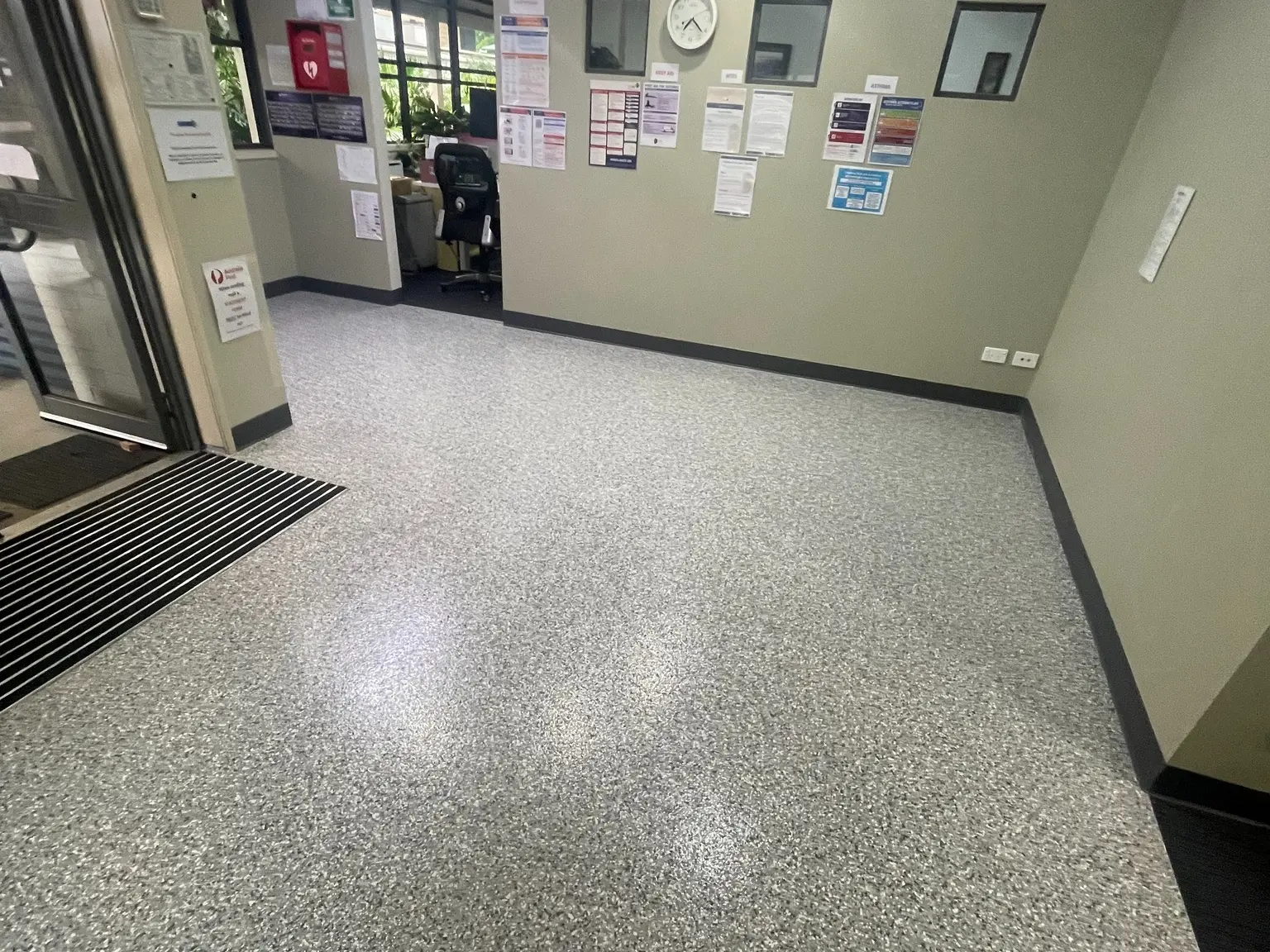 A school corridor using Ultra Flake Cookies and Cream on Pipeline Grey